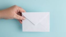 Hand holding a letter